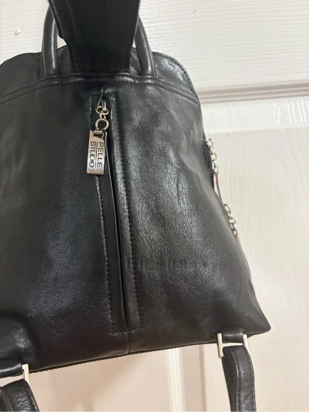 Pelle studios from Wilson leather back pack /organizer. Measures 9 by 9 by 3”